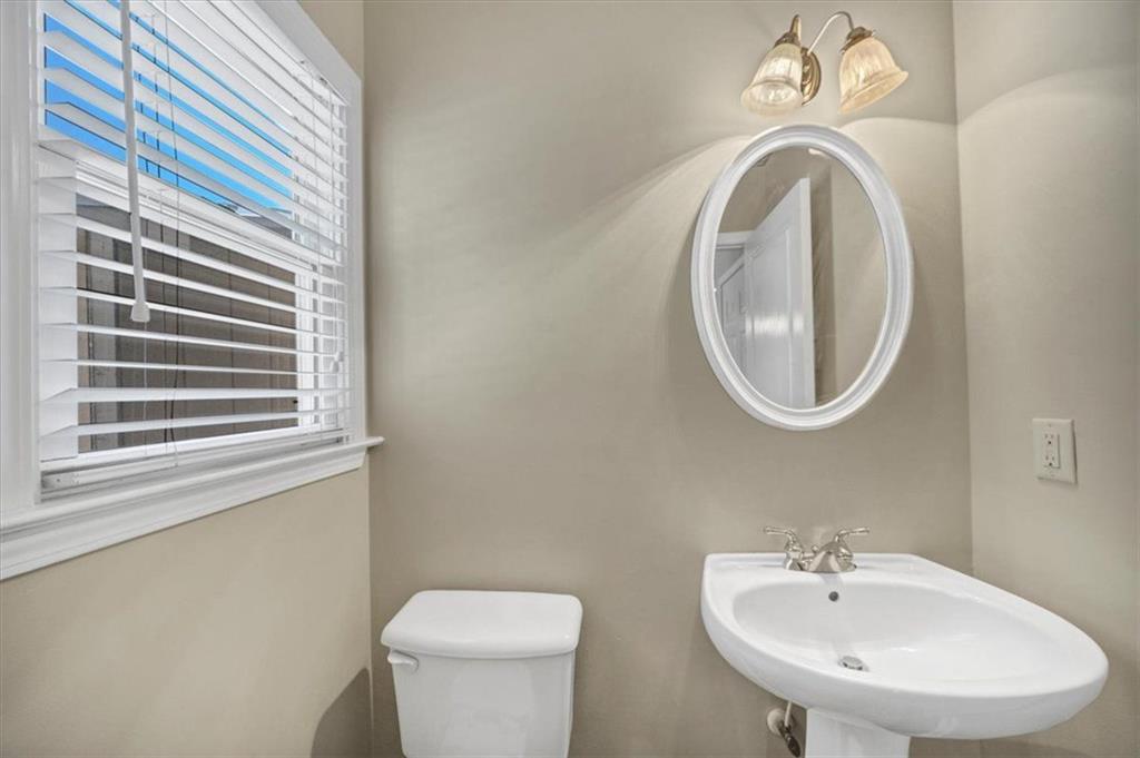 501 Middlebrooke Trace Canton, GA 30115 - Photo 20 of 29 a bathroom with a sink a mirror and a toilet