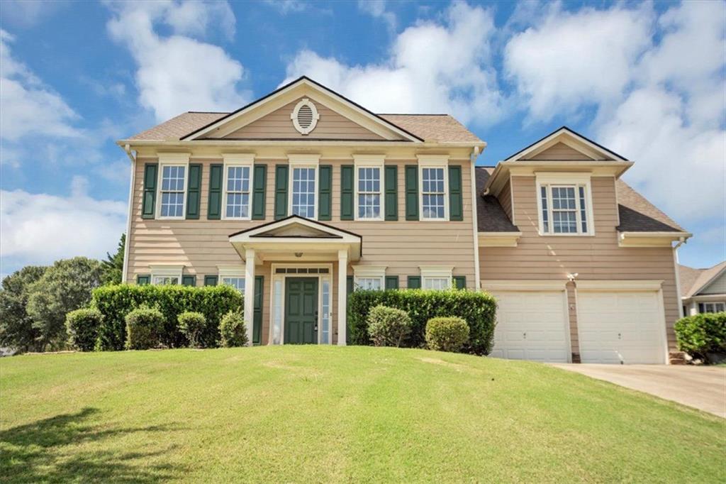 501 Middlebrooke Trace Canton, GA 30115 - Photo 2 of 29 a front view of a house with a yard and garage