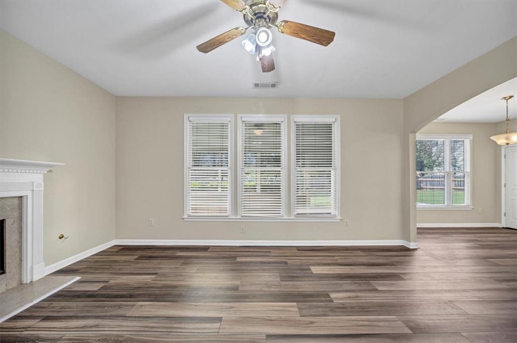 501 Middlebrooke Trace Canton, GA 30115 - Photo 22 of 29 a view of an empty room with wooden floor and a window