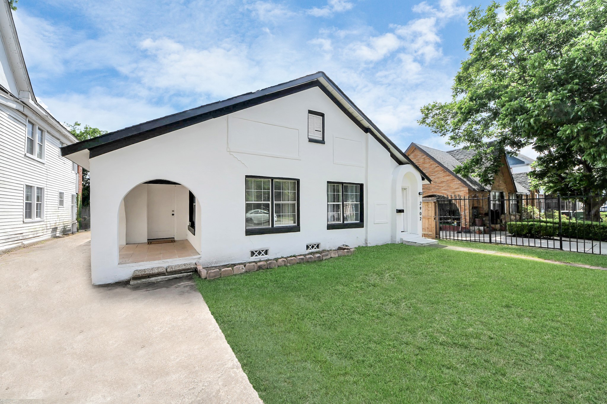 2902 Truxillo Street Houston, TX 77004 - Photo 2 of 32 a front view of a house with a yard and garage