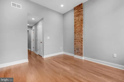 a view of entryway with wooden floor