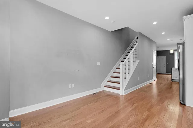 a view of an entryway with wooden floor