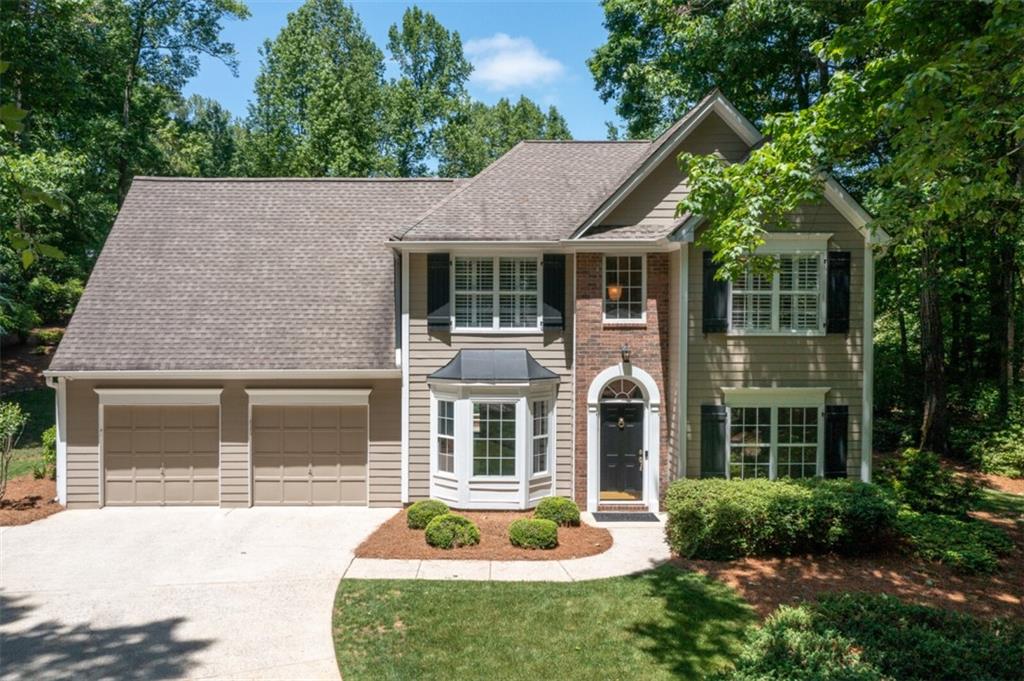 810 Sable Pointe Road Alpharetta, GA 30004 - Photo 1 of 1 front view of a house with a yard