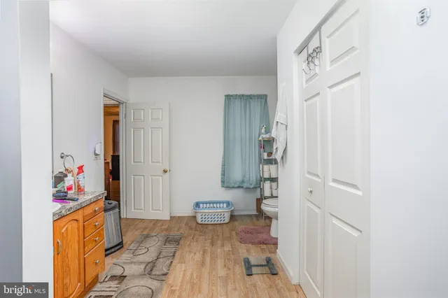 a view of an entryway with wooden floor