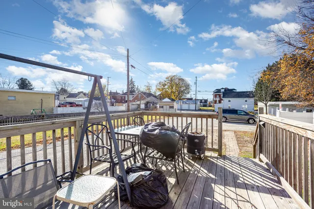 a view of a balcony with furniture