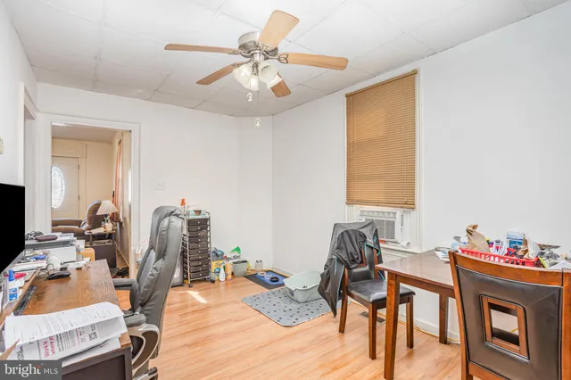 a workspace with furniture and wooden floor
