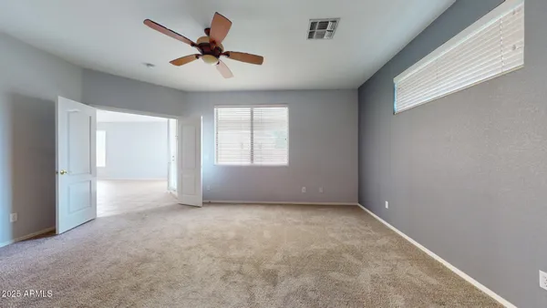 a view of an empty room with a window