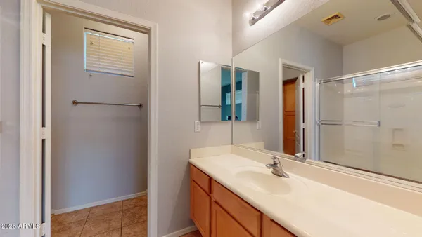 a bathroom with a sink and mirror