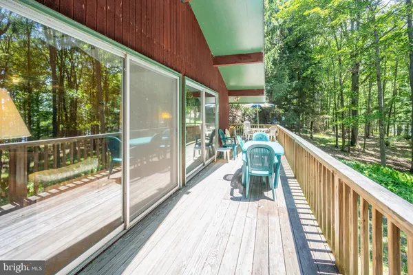 a kitchen with stainless steel appliances granite countertop a refrigerator a sink and a stove