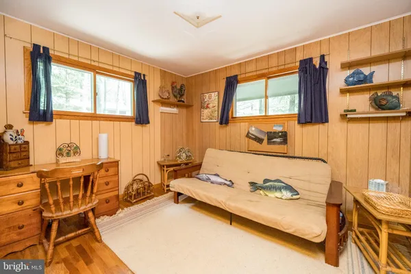 a bed room with furniture and a flat screen tv