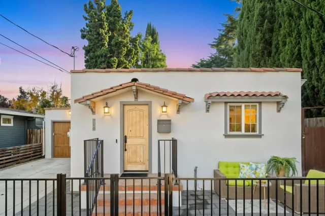 a view of a brick house with a large windows