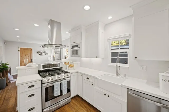 a spacious bathroom with a sink and a mirror