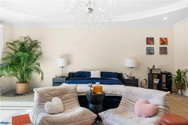 a spacious bedroom with a large bed and a large window