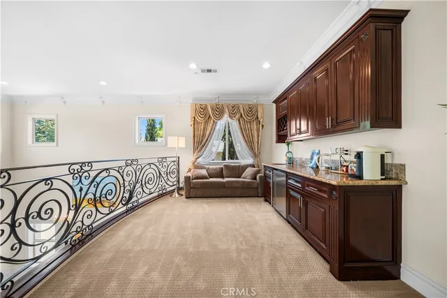 a kitchen with stainless steel appliances granite countertop a sink and a cabinets