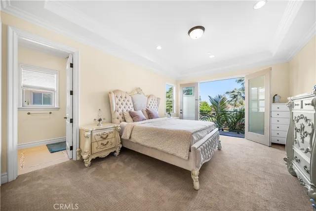 a spacious bedroom with a bed and a table