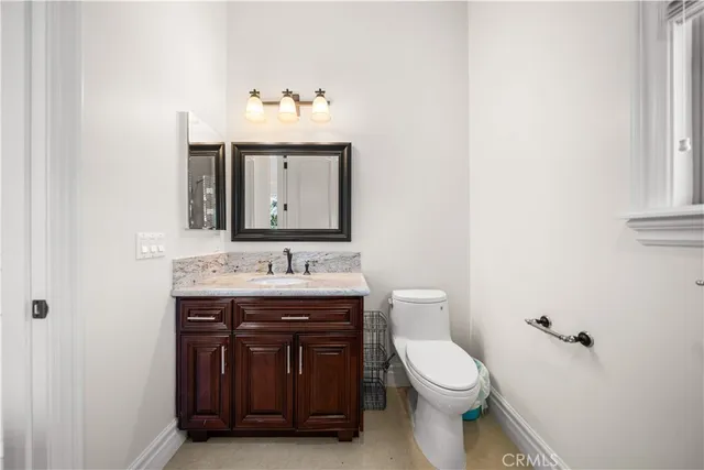 a bed room with a bed and a chair