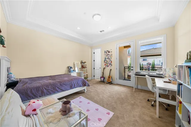 a bedroom with a bed and a desk