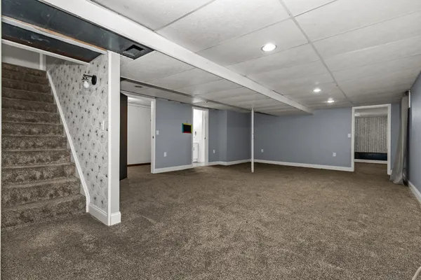 a view of an empty room with a fireplace