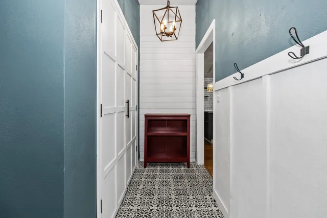 a view of a hallway with a white walls