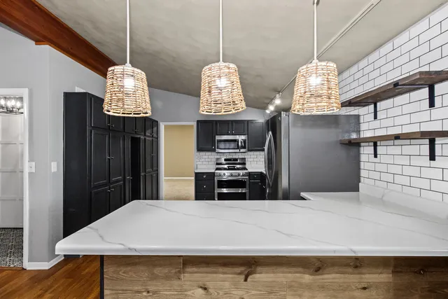 a very nice looking dining room with a table and chandelier