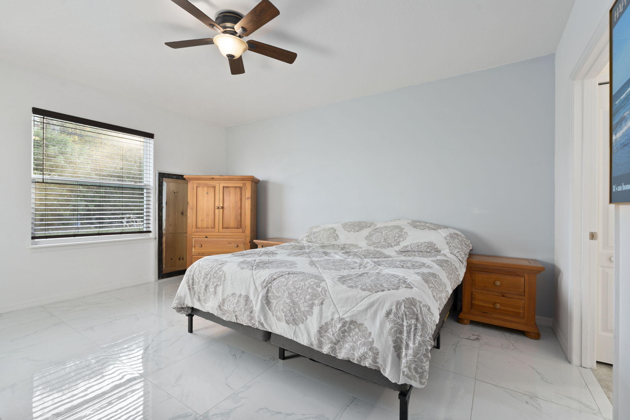 1414 Southwest Crest Avenue Port St. Lucie, FL 34953 - Photo 15 of 41 a bedroom with a bed and window