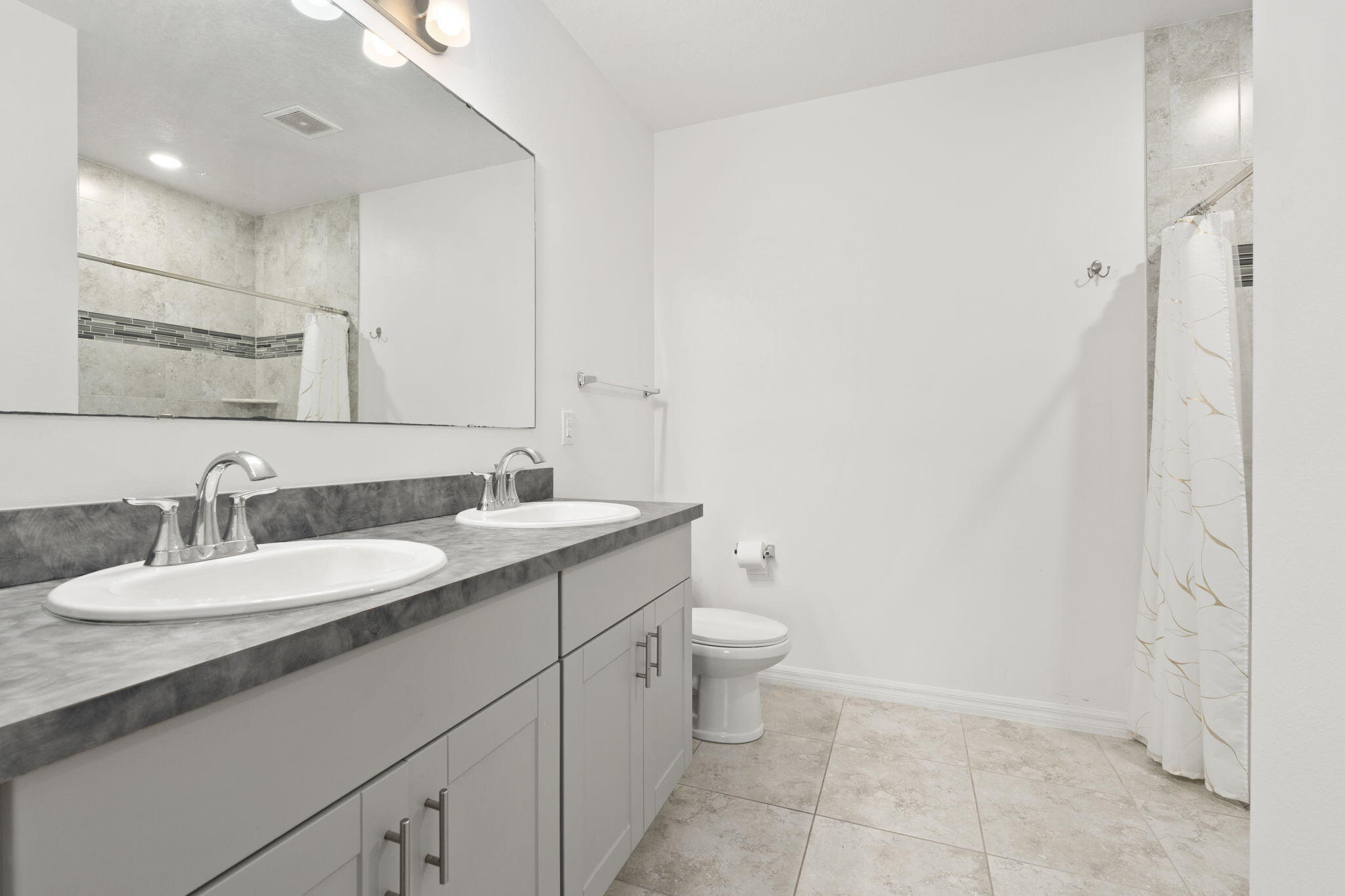 1414 Southwest Crest Avenue Port St. Lucie, FL 34953 - Photo 16 of 41 a bathroom with a granite countertop sink and a mirror