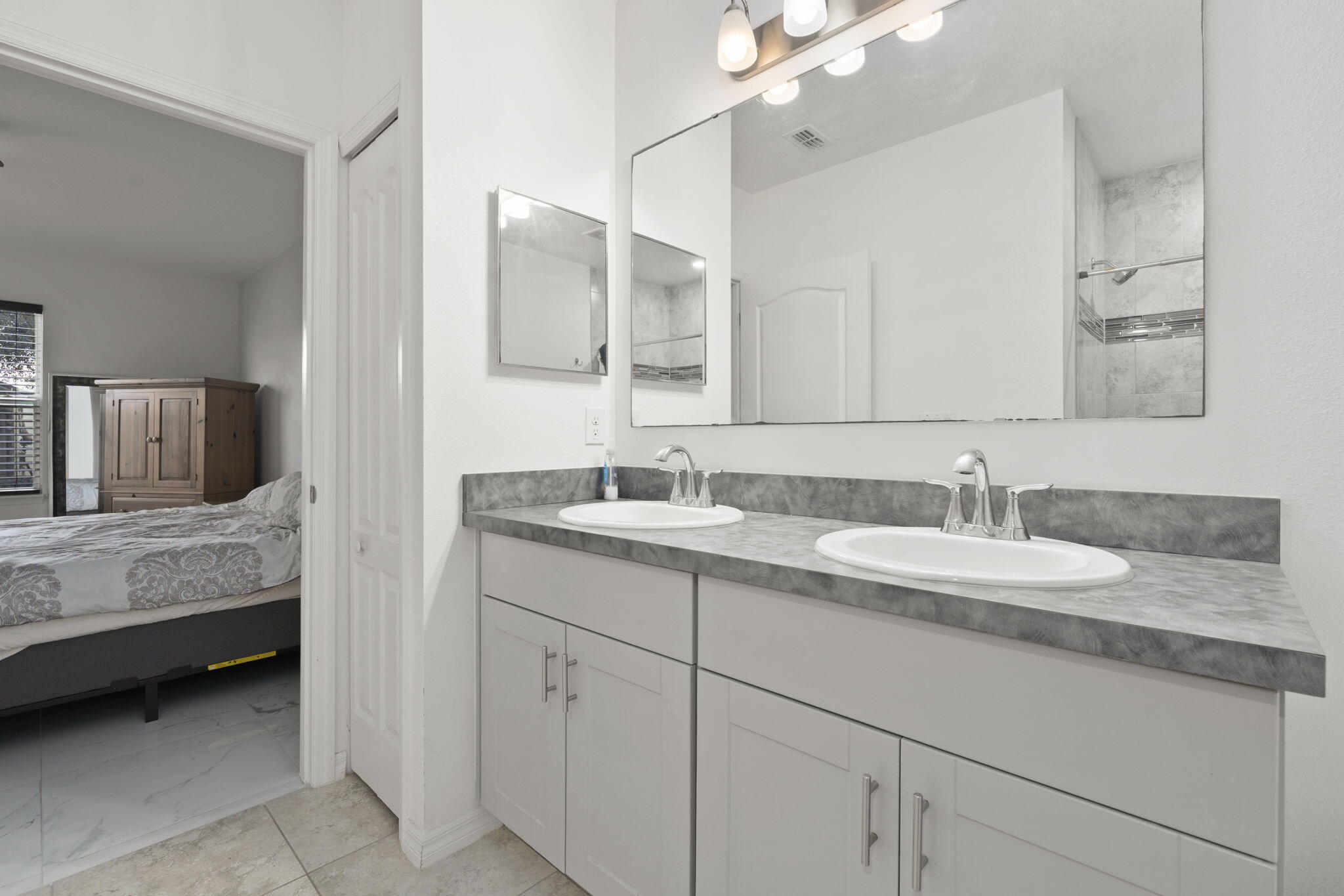 1414 Southwest Crest Avenue Port St. Lucie, FL 34953 - Photo 17 of 41 a bathroom with a sink and a mirror