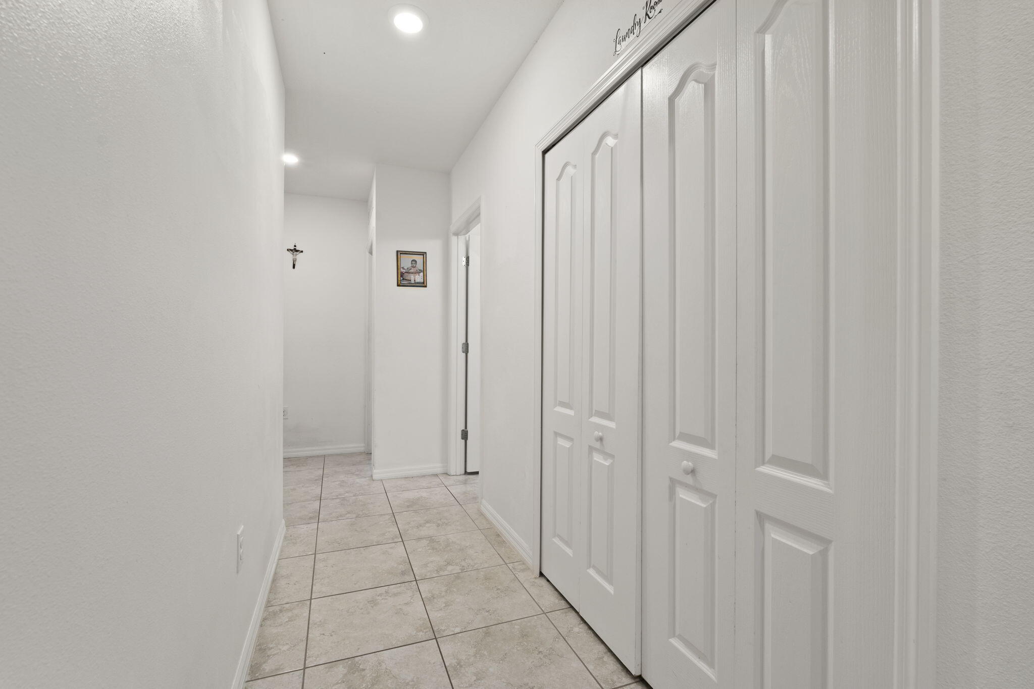 1414 Southwest Crest Avenue Port St. Lucie, FL 34953 - Photo 20 of 41 a view of a hallway with white doors