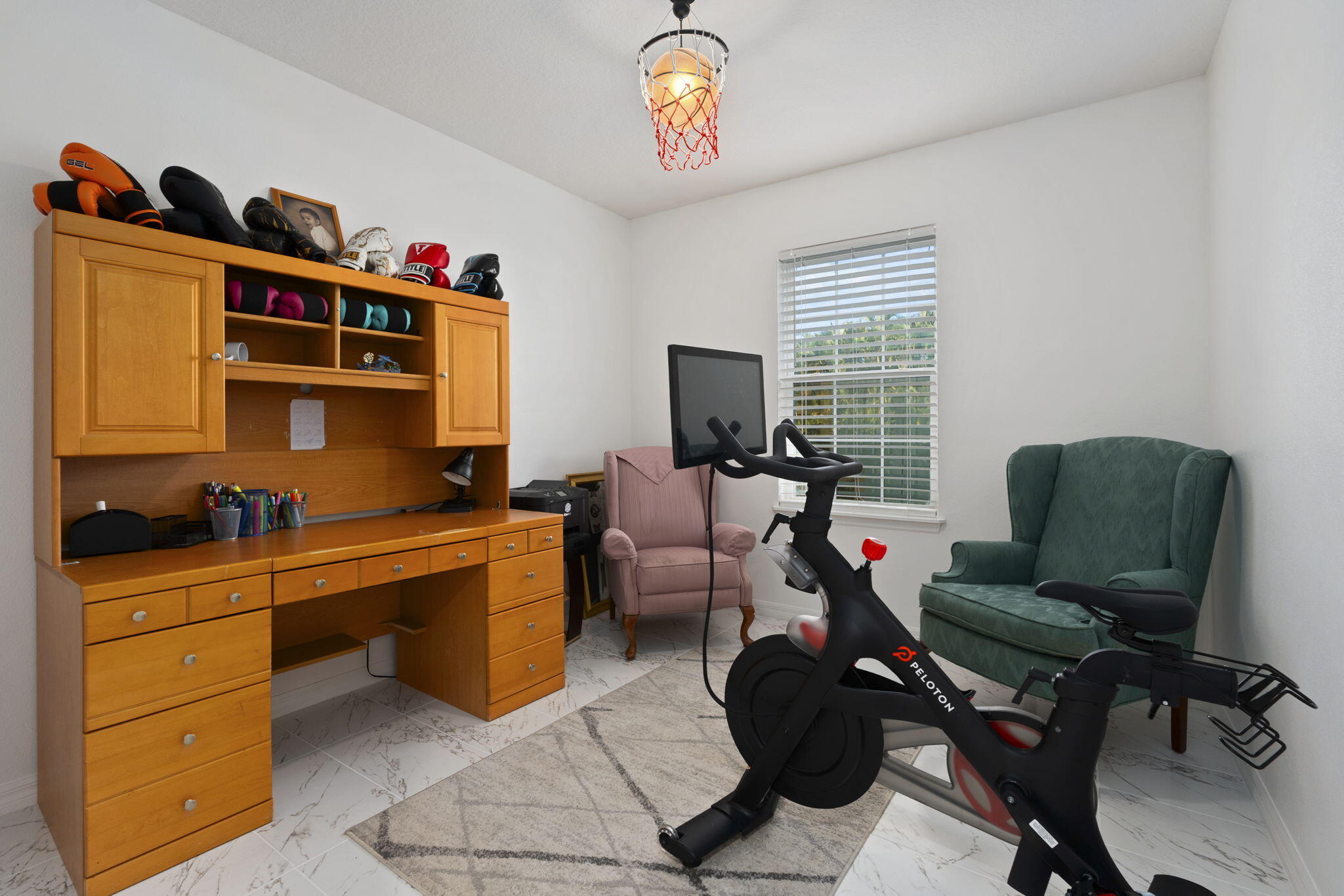 1414 Southwest Crest Avenue Port St. Lucie, FL 34953 - Photo 22 of 41 a view of a workspace with furniture and a window