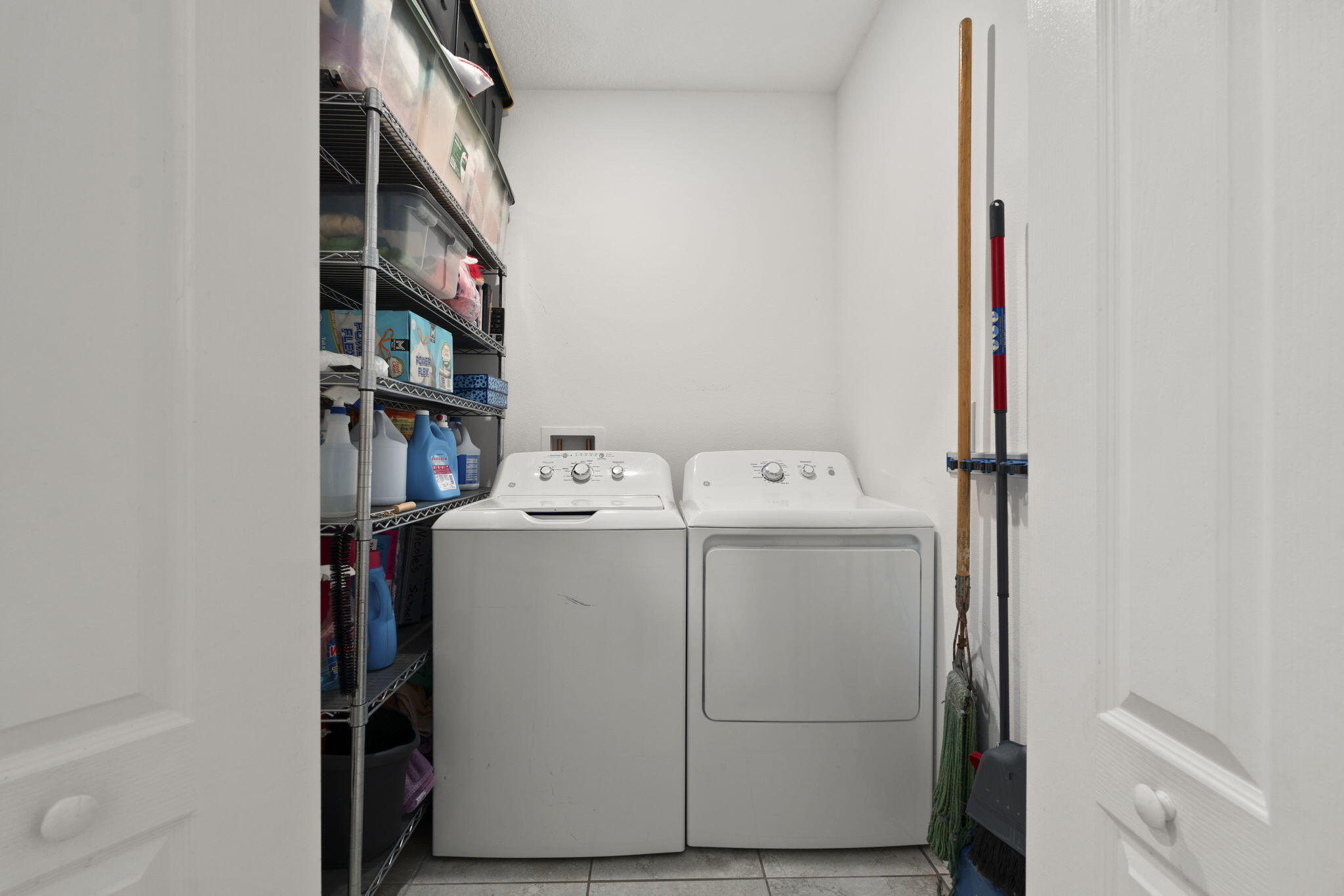 1414 Southwest Crest Avenue Port St. Lucie, FL 34953 - Photo 26 of 41 a utility room with dryer and washer