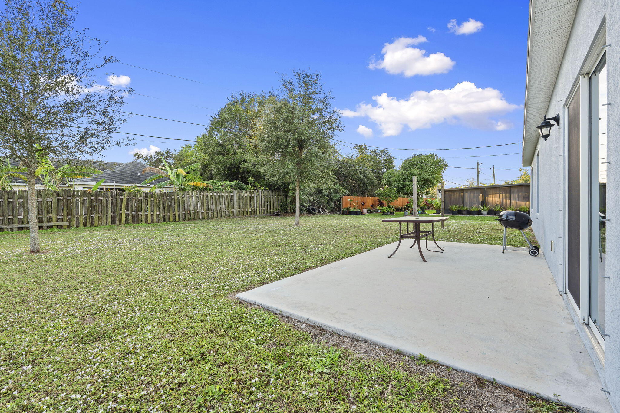 1414 Southwest Crest Avenue Port St. Lucie, FL 34953 - Photo 27 of 41 a view of a garden with a slide