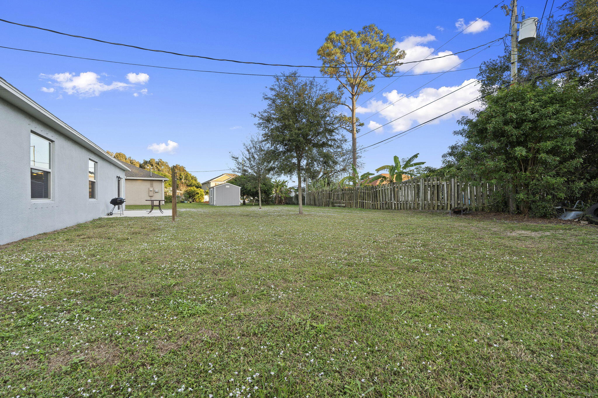 1414 Southwest Crest Avenue Port St. Lucie, FL 34953 - Photo 31 of 41 a view of a backyard