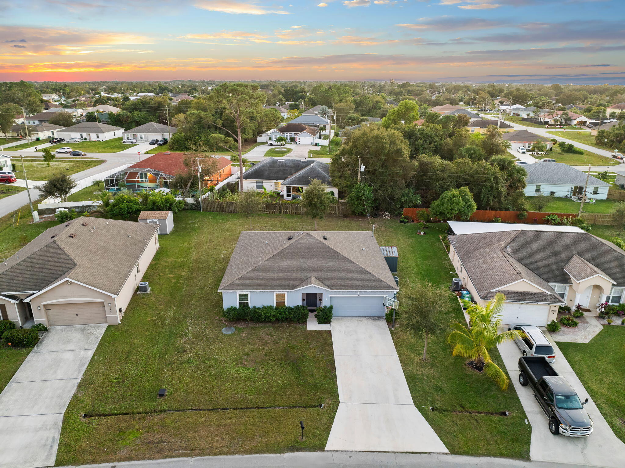 1414 Southwest Crest Avenue Port St. Lucie, FL 34953 - Photo 32 of 41 an aerial view of multiple houses with yard