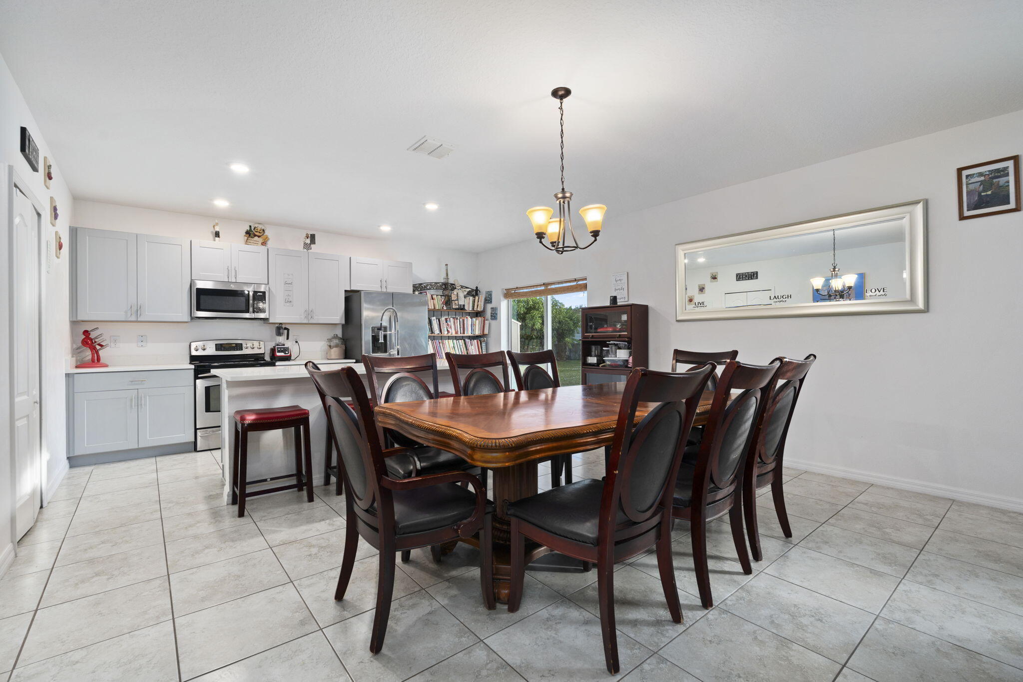 1414 Southwest Crest Avenue Port St. Lucie, FL 34953 - Photo 9 of 41 a view of a dining room with furniture