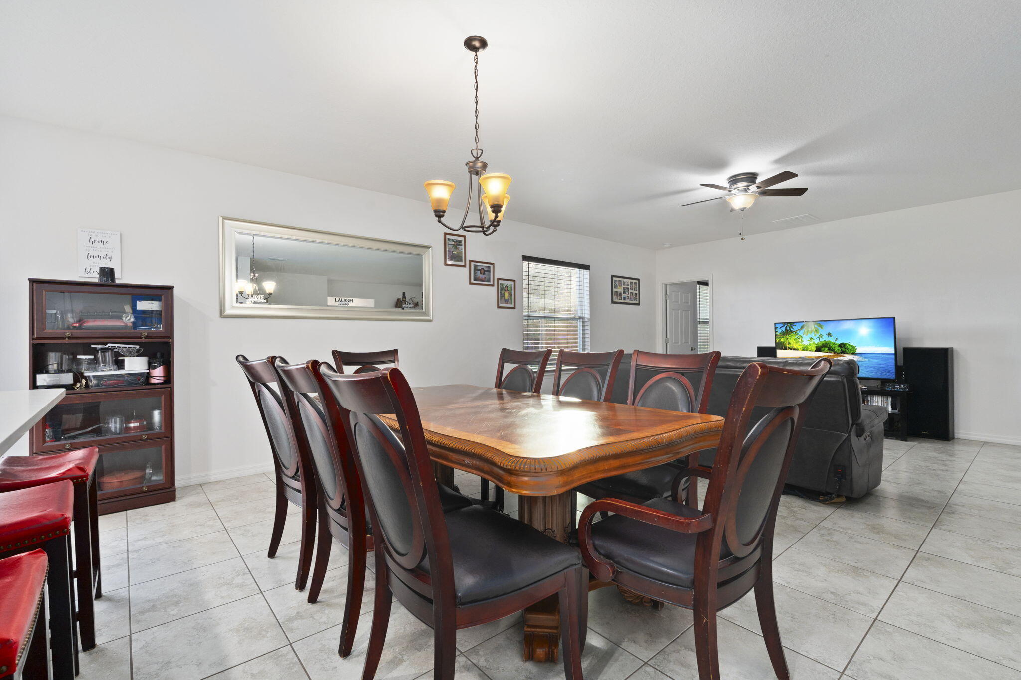1414 Southwest Crest Avenue Port St. Lucie, FL 34953 - Photo 10 of 41 a view of a dining room and livingroom with furniture