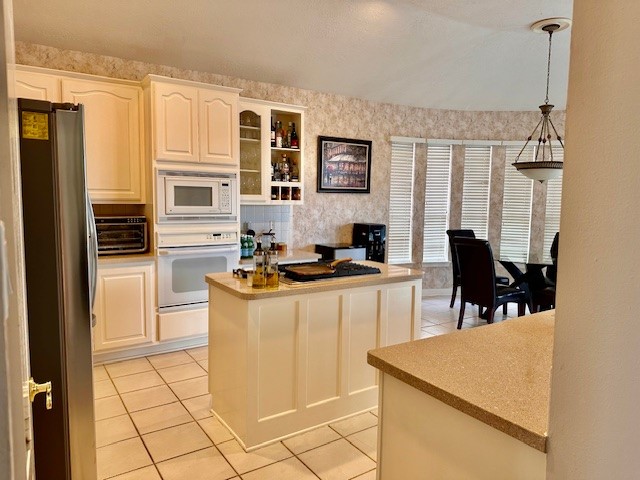 7802 Percussion Place Houston, TX 77040 - Photo 6 of 9 a kitchen with stainless steel appliances granite countertop a stove a sink and a refrigerator