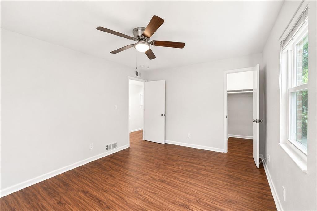 3203 East Point Street, Unit 4 Atlanta, GA 30344 - Photo 11 of 18 an empty room with wooden floor closet and windows