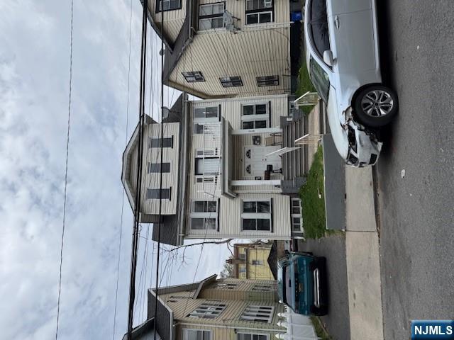 219 Renner Avenue Newark, NJ 07112 - Photo 1 of 22 a front view of a house with parking space