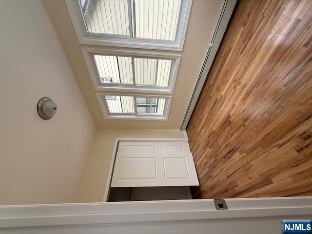 219 Renner Avenue Newark, NJ 07112 - Photo 11 of 22 a view of an empty room with wooden floor and a window