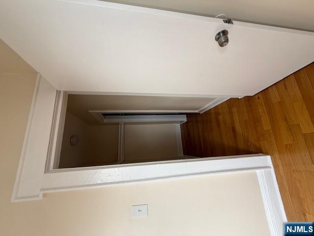 219 Renner Avenue Newark, NJ 07112 - Photo 12 of 22 a view of a hallway with wooden floor and staircase