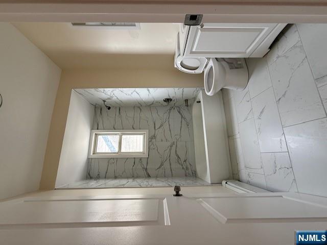219 Renner Avenue Newark, NJ 07112 - Photo 16 of 22 a bathroom with a toilet and a bath tub