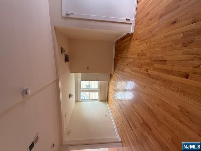 219 Renner Avenue Newark, NJ 07112 - Photo 2 of 22 a view of empty room with wooden floor and fan