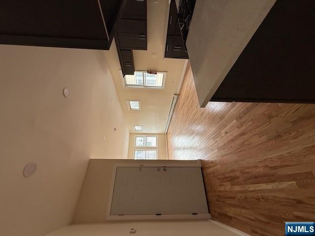 219 Renner Avenue Newark, NJ 07112 - Photo 6 of 22 a kitchen with a wooden floor and window