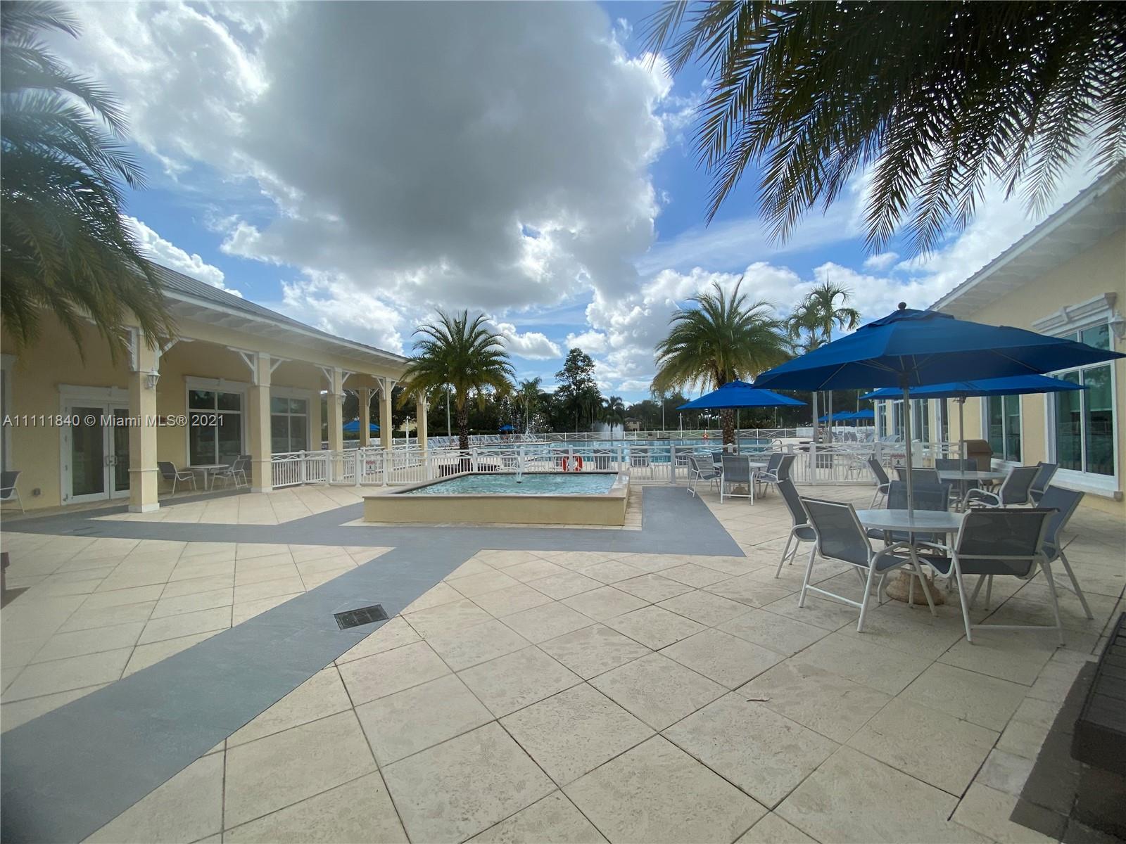 Oasis Homestead, FL 33033 - Photo 15 of 21 a view of a patio with swimming pool table and chairs