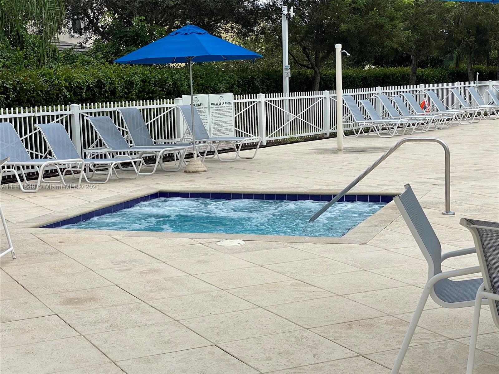 Oasis Homestead, FL 33033 - Photo 17 of 21 swimming pool view with a seating space