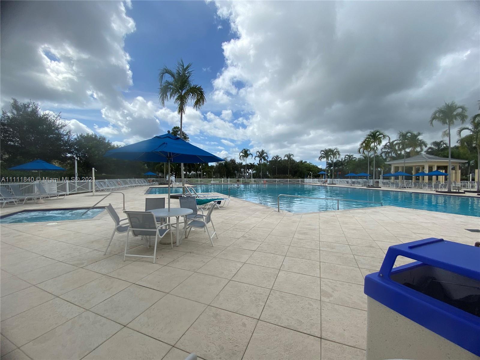 Oasis Homestead, FL 33033 - Photo 18 of 21 a view of a lake with table and chairs