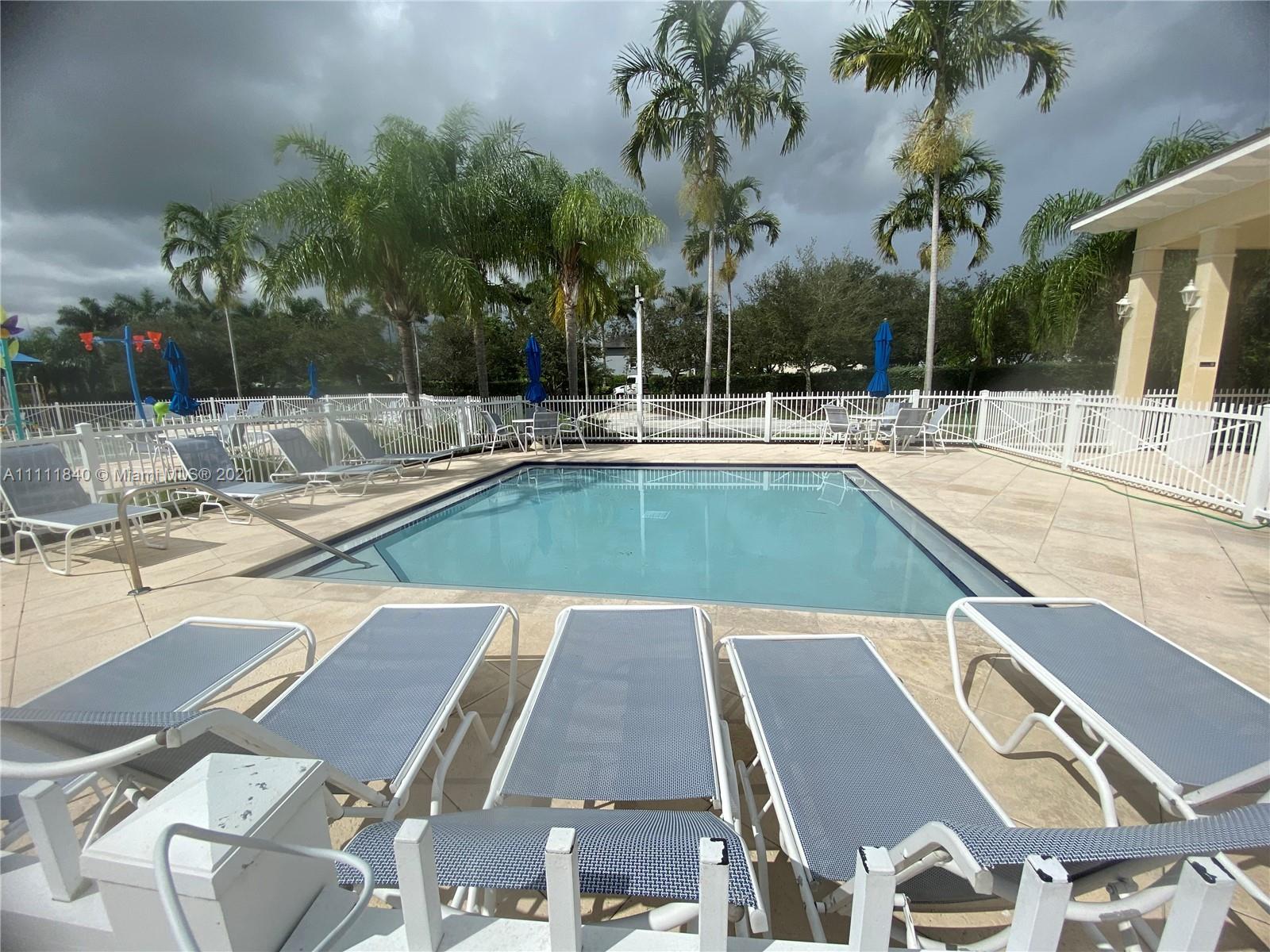 Oasis Homestead, FL 33033 - Photo 19 of 21 a view of a swimming pool with a patio