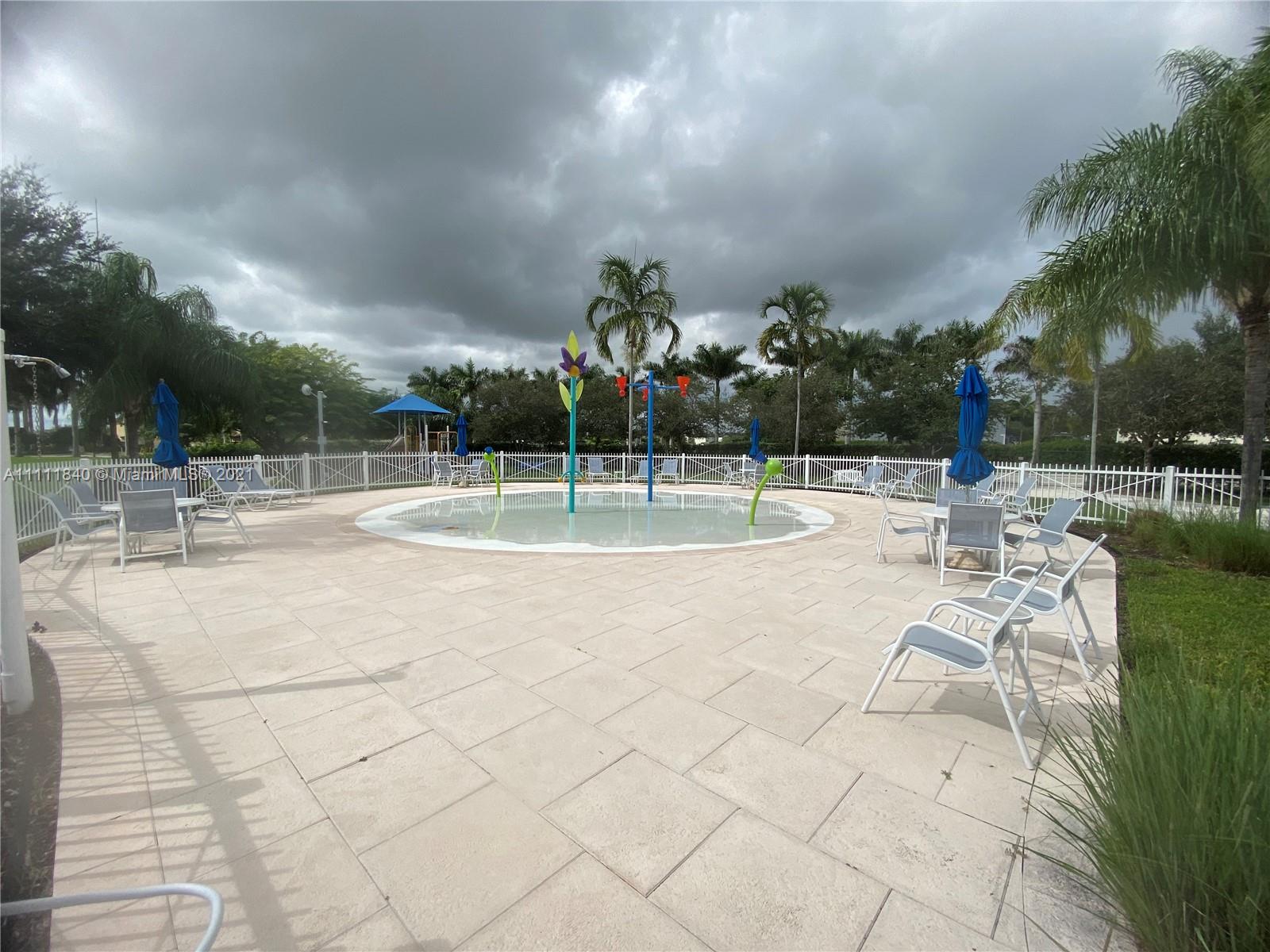 Oasis Homestead, FL 33033 - Photo 20 of 21 a view of a playground with basketball court