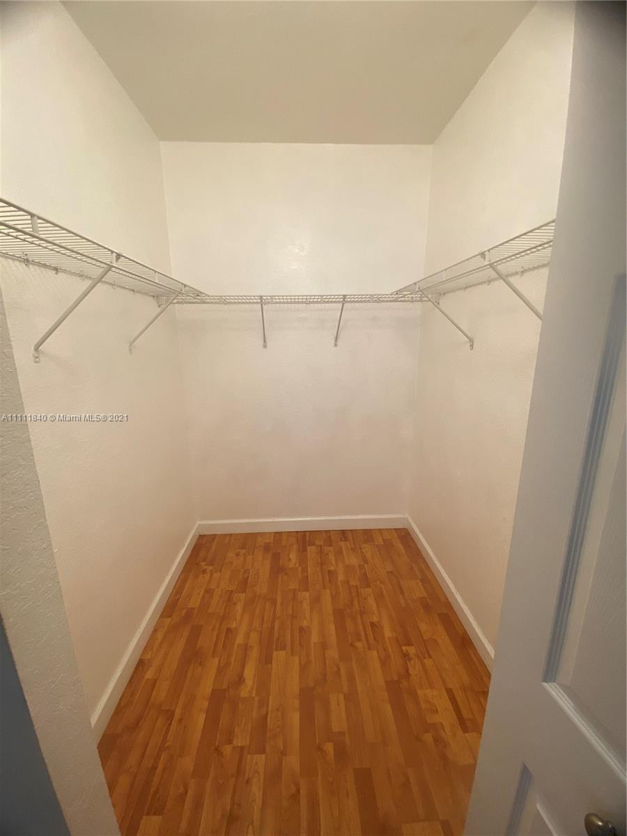 Oasis Homestead, FL 33033 - Photo 7 of 21 a view of a room with racks on the wall