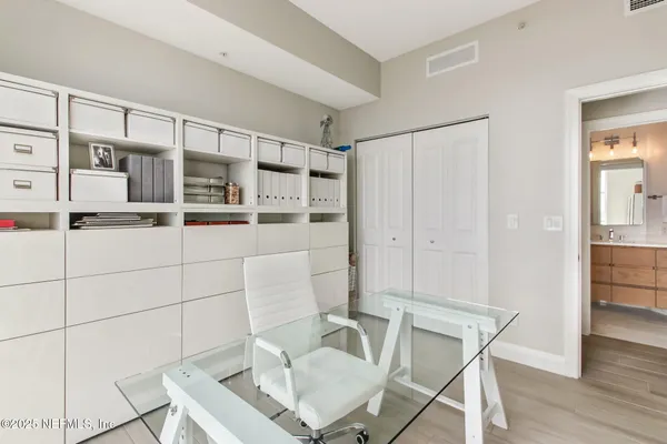 a workspace with furniture and wooden floor
